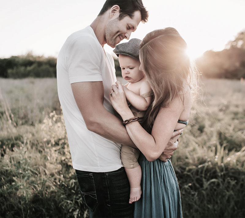 Couple embracing baby